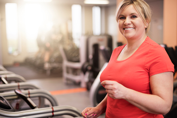 Woman walking on treadmill