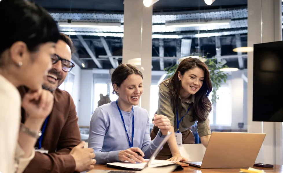 Diverse business team collaborating around a table in a modern office
